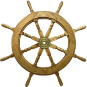 20th century oak ship's wheel with eight turned spokes and brass central boss