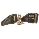 Two continental autoharps; military style copper and brass bugle; and a gourd five-key thumb piano '