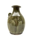 Jim Malone (British 1946-): Stoneware flask with trailing green glaze