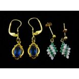 Pair of gold blue stone set pendant earrings and a pair of gold cubic zirconia and emerald pendant s