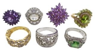 Seven silver and silver-gilt dress rings including two cubic zirconia flower open work rings