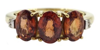 9ct gold three stone oval cognac zircon and baguette chip diamond ring