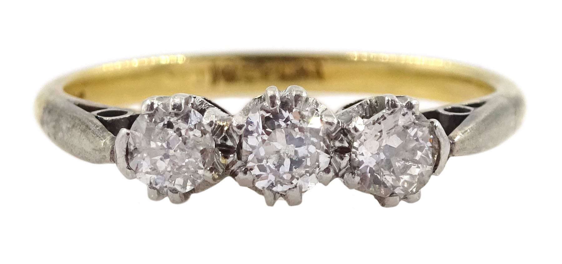 Gold three stone diamond ring