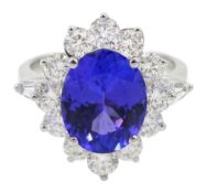 18ct white gold oval tanzanite and round brilliant cut diamond cluster ring