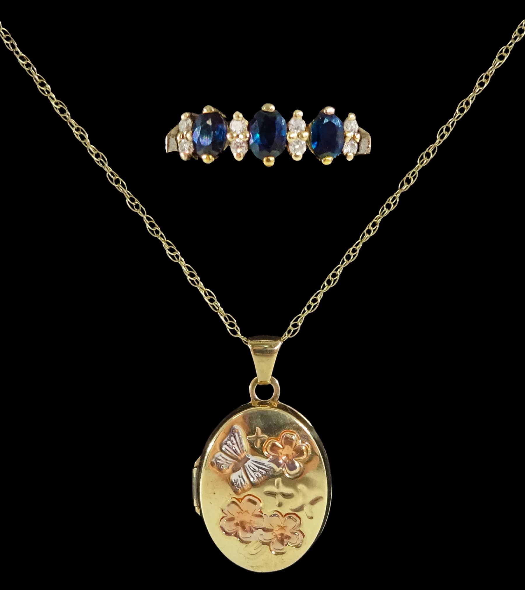 Gold butterfly and flower design locket pendant necklace and a gold sapphire and diamond dress ring