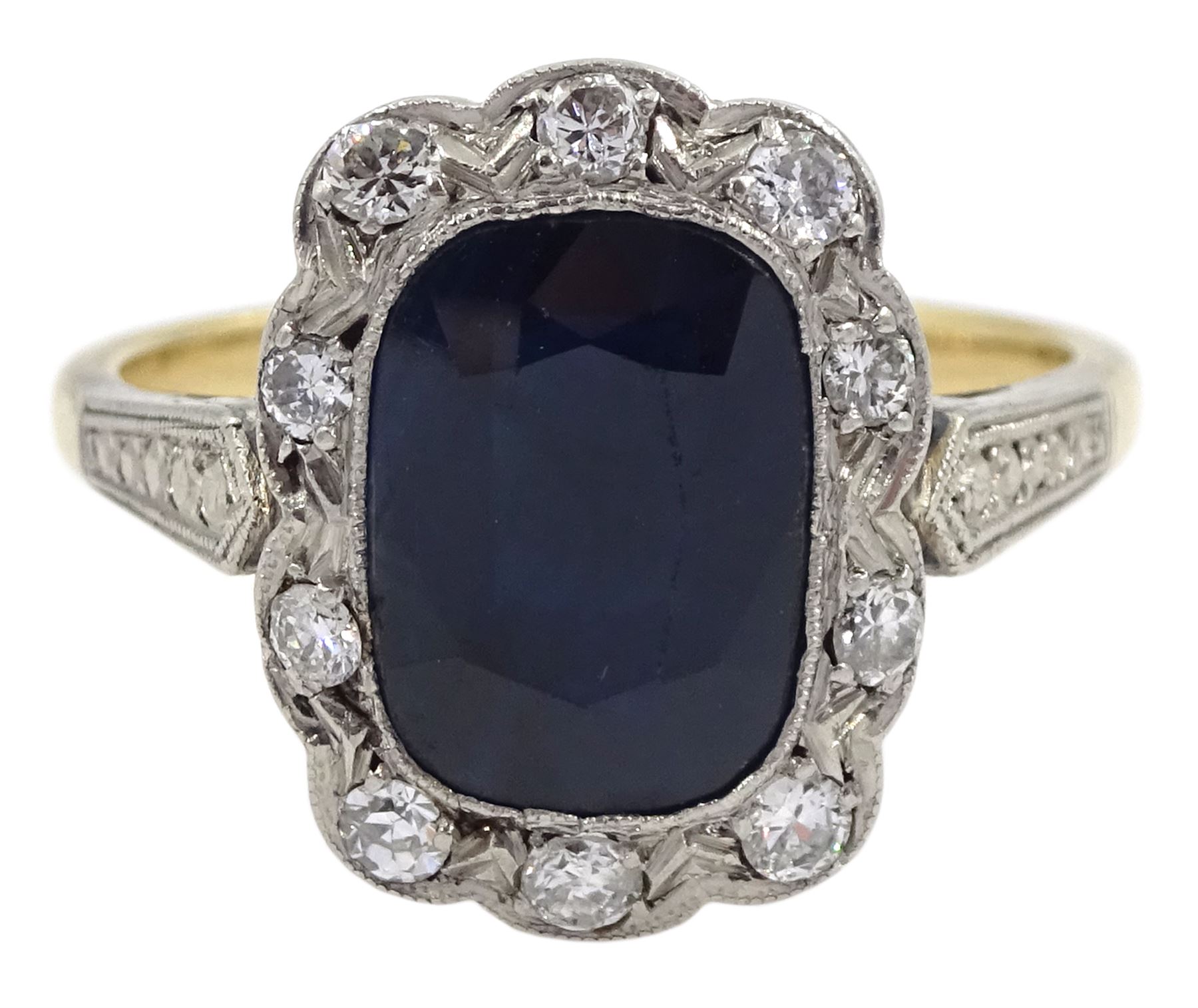 Art Deco style gold rectangular cushion cut sapphire and diamond cluster ring