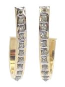 Pair of gold diamond half hoop earrings