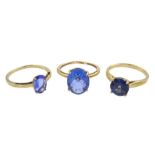 Three 9ct gold single stone blue stone set rings