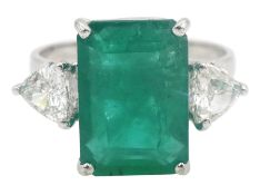 White gold three stone large emerald and trillion cut diamond ring