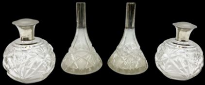 Pair of silver collared and lidded perfume bottles of bulbous form together with a pair of silver co