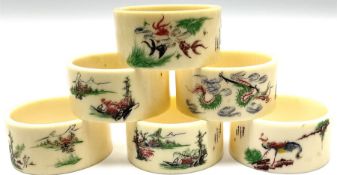 Set of six early 20th century Chinese ivory napkin rings decorated with figural scenes and calligrap