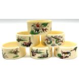 Set of six early 20th century Chinese ivory napkin rings decorated with figural scenes and calligrap