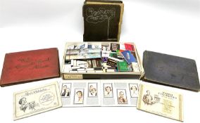 Collection of match boxes and cigarette cards in albums