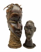 Two carved African heads