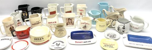 Collection of ceramic pub jugs and ashtrays