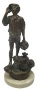 Spelter figure of a boy shouting on a stone base