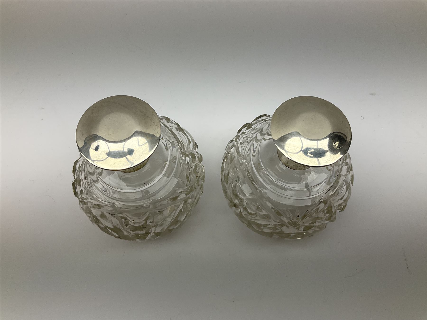 Pair of silver collared and lidded perfume bottles of bulbous form together with a pair of silver co - Image 21 of 28