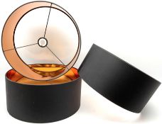 Three 'Oro' pendant drum lamp shades in black and copper
