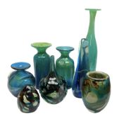 Quantity of M’dina art glass to include a streaked blue and green bottle form vase with captured bub