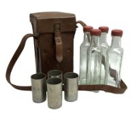 WWII leather cased set of four glass flasks and cylindrical cups