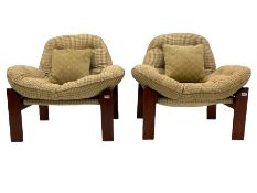 A pair of mid-20th century stained teak framed slung seat chairs
