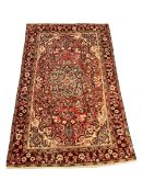 Persian red and beige ground rug