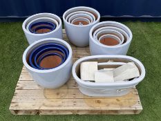 Quantity of light and dark blue glazed garden planters in various sizes and shapes