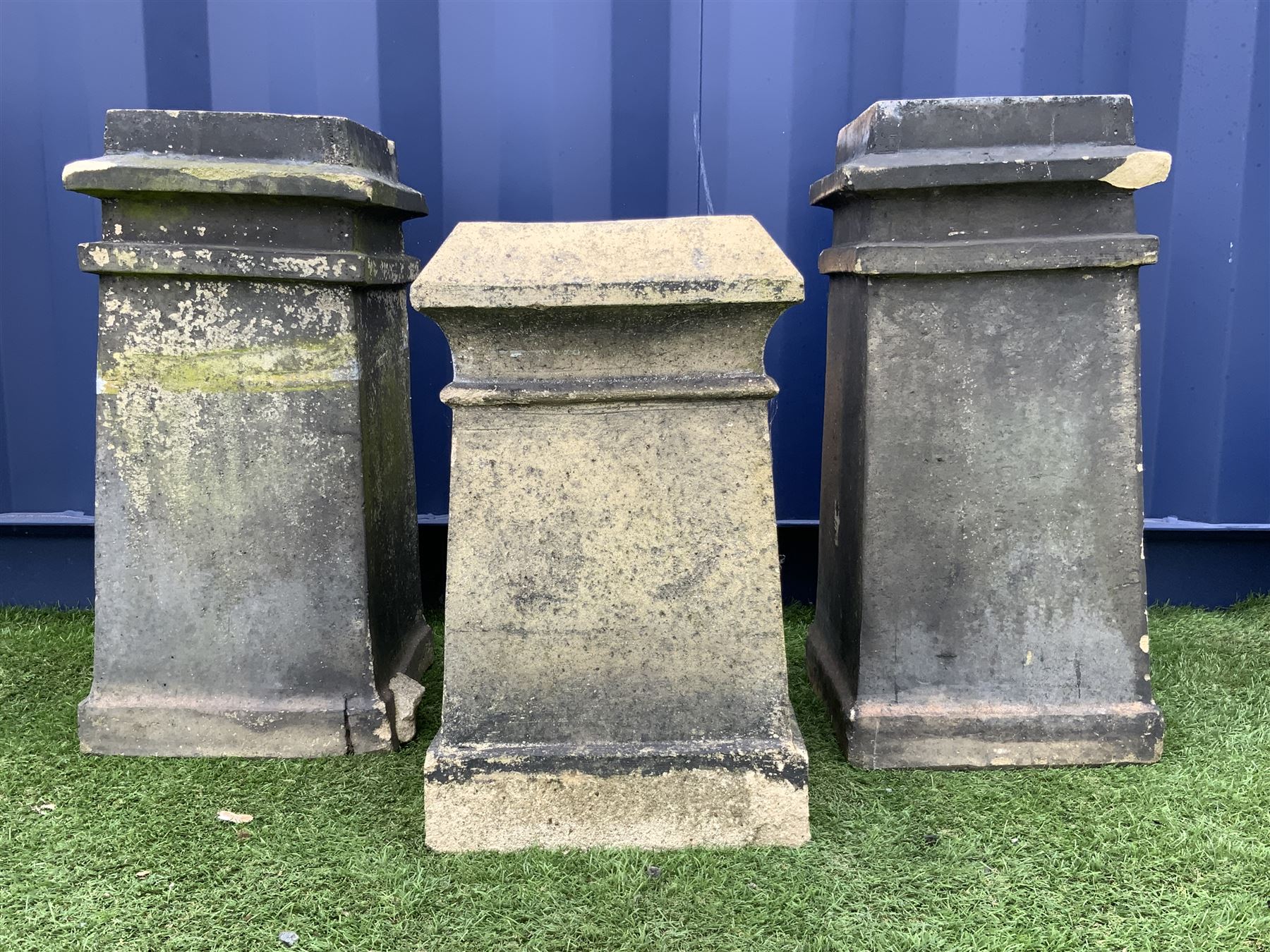 Three Victorian terracotta square tapered chimney pots