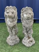 Pair composite stone seated lion figures/gate post toppers