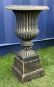 Cast iron Campana shaped urn on plinth