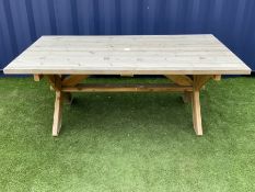 Alexander Rose - large pine rectangular garden table on x-frame end supports joined by pegged stretc