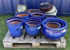 Collection of blue glazed plant pots and planters