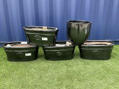 Quantity of black glazed garden planters in various sizes and shapes