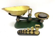 A set of kitchen scales and full set of weights
