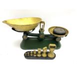 A set of kitchen scales and full set of weights