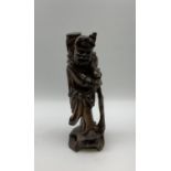 Chinese carved wooden figure of a traveller H36cm.