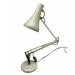 White metal angle poise type desk lamp.