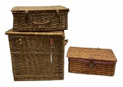 Two wicker picnic baskets with hinged lids