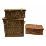 Two wicker picnic baskets with hinged lids