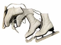Two pair of leather ice skates
