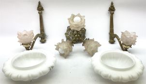 Pair of gilt metal wall sconces with glass shades modeled as flowers