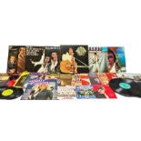 Quantity of vinyl records to include an Elvis Presley Greatest Hits box set and other records by Elv