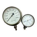Brass 'Budenberg Gauge Co' pressure gauge and another similar brass example