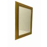 Gilt framed wall mirror