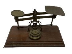 Brass postal scales with rates displayed and three weights