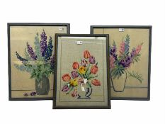 Three late 20th century framed needleworks of flowers