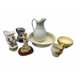 The Leonardo collection figure 'the promenade' together with Royal ivory bowl in sunset ware pattern