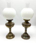 Two brassed oil lamps with glass shades and chimneys