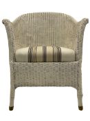 Painted wicker chair with upholstered seat cushion