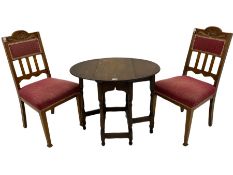 Pair early 20th century oak chairs with upholstered seats and an oak drop leaf table on spindle turn